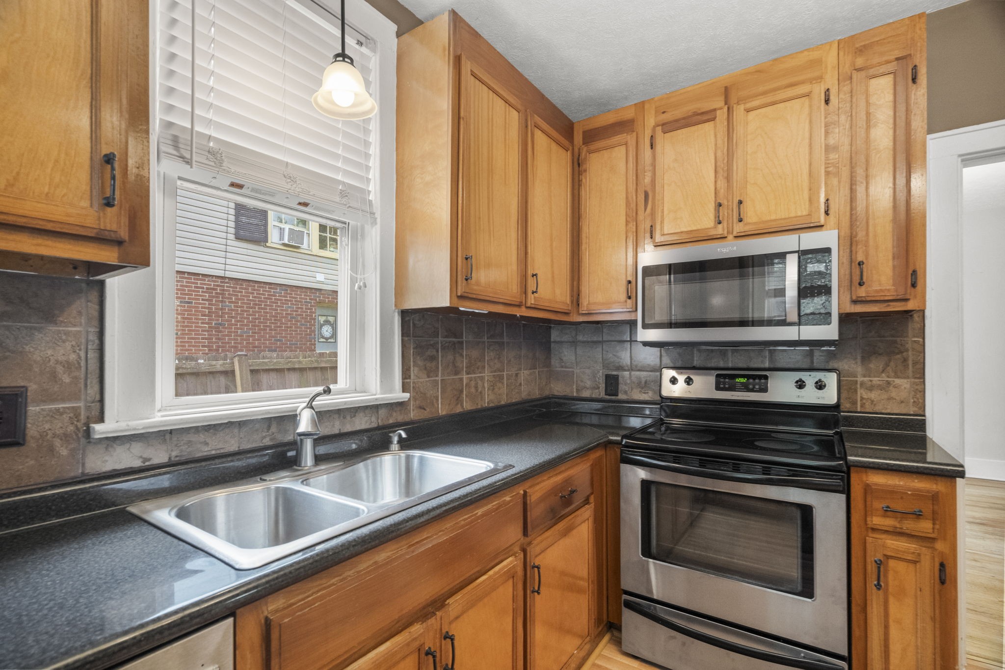 400 Connell Street Springfield, TN 37172 - Photo 8 of 53 a kitchen with stainless steel appliances granite countertop a sink stove and microwave
