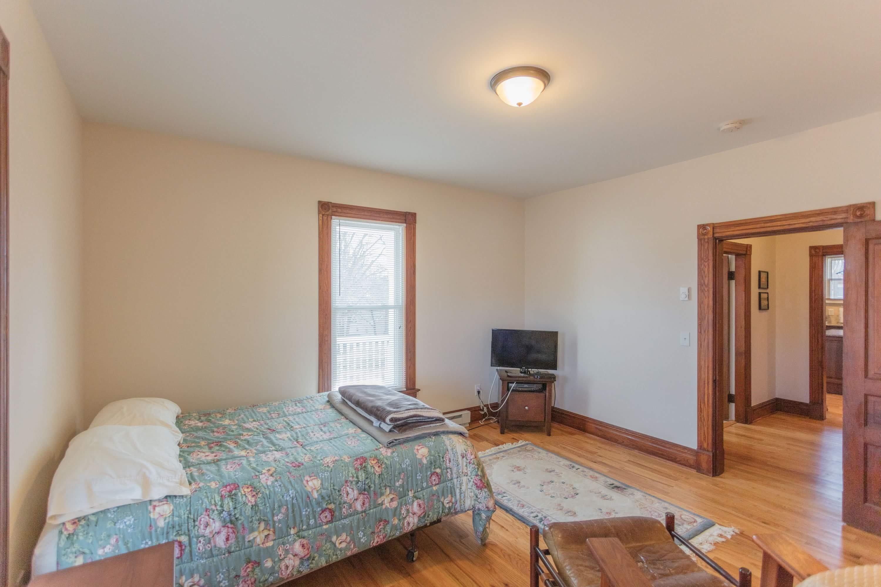 11 Shady Lane Raphine, VA 24472 - Photo 17 of 41 a bedroom with a bed and wooden floor