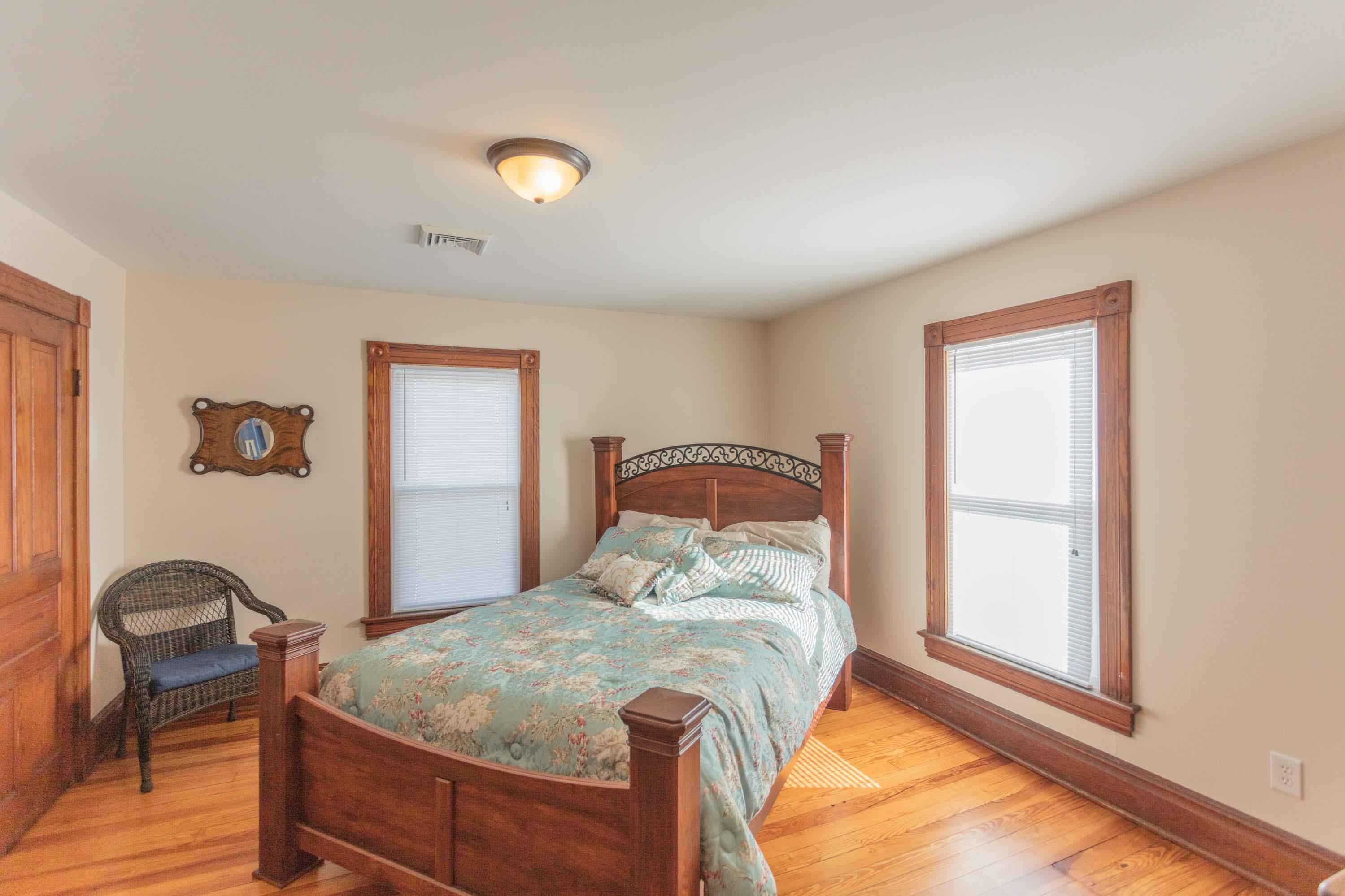 11 Shady Lane Raphine, VA 24472 - Photo 28 of 41 a bedroom with a bed and dresser with a large window