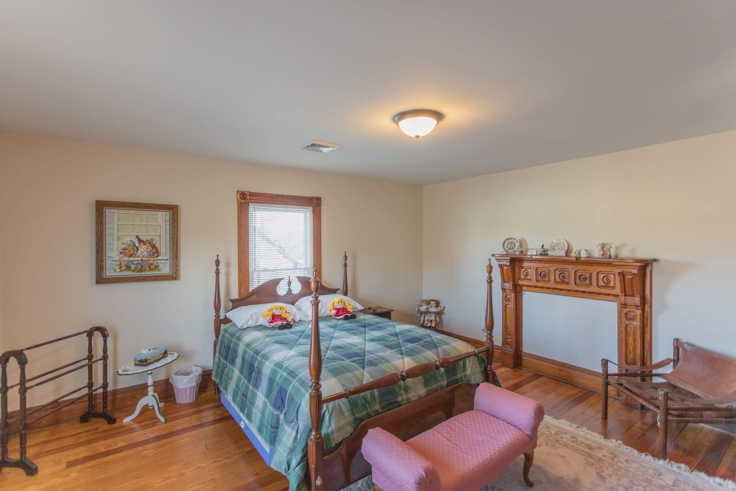 11 Shady Lane Raphine, VA 24472 - Photo 35 of 41 a bedroom with a bed and a workspace