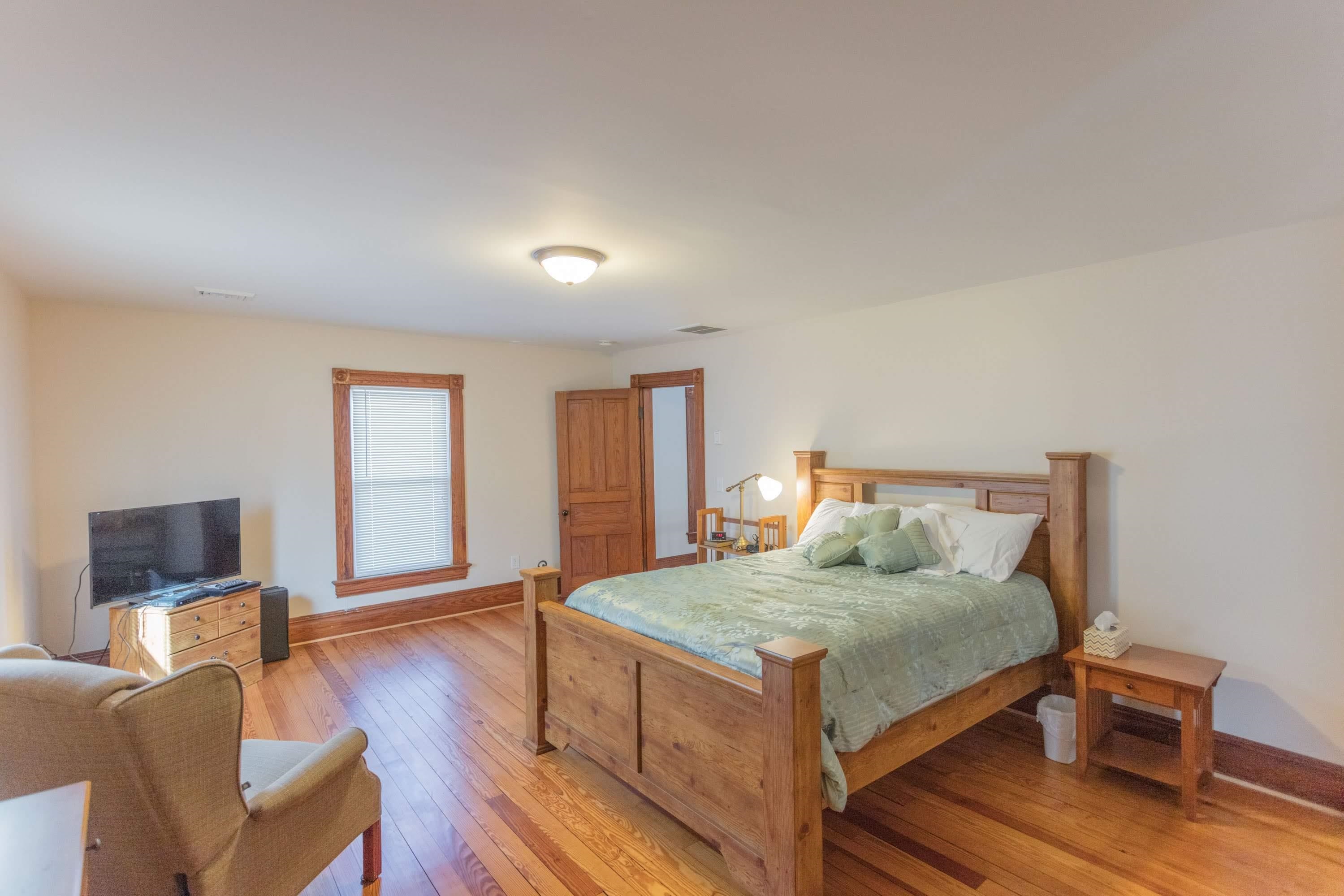 11 Shady Lane Raphine, VA 24472 - Photo 38 of 41 a bedroom with a bed and wooden floor