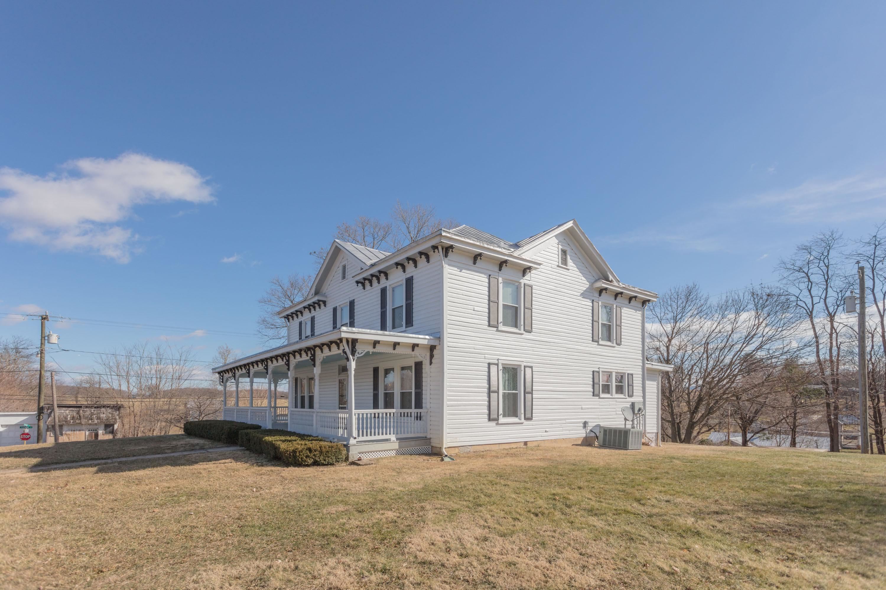 11 Shady Lane Raphine, VA 24472 - Photo 4 of 41 a view of a white house with a big yard and large trees