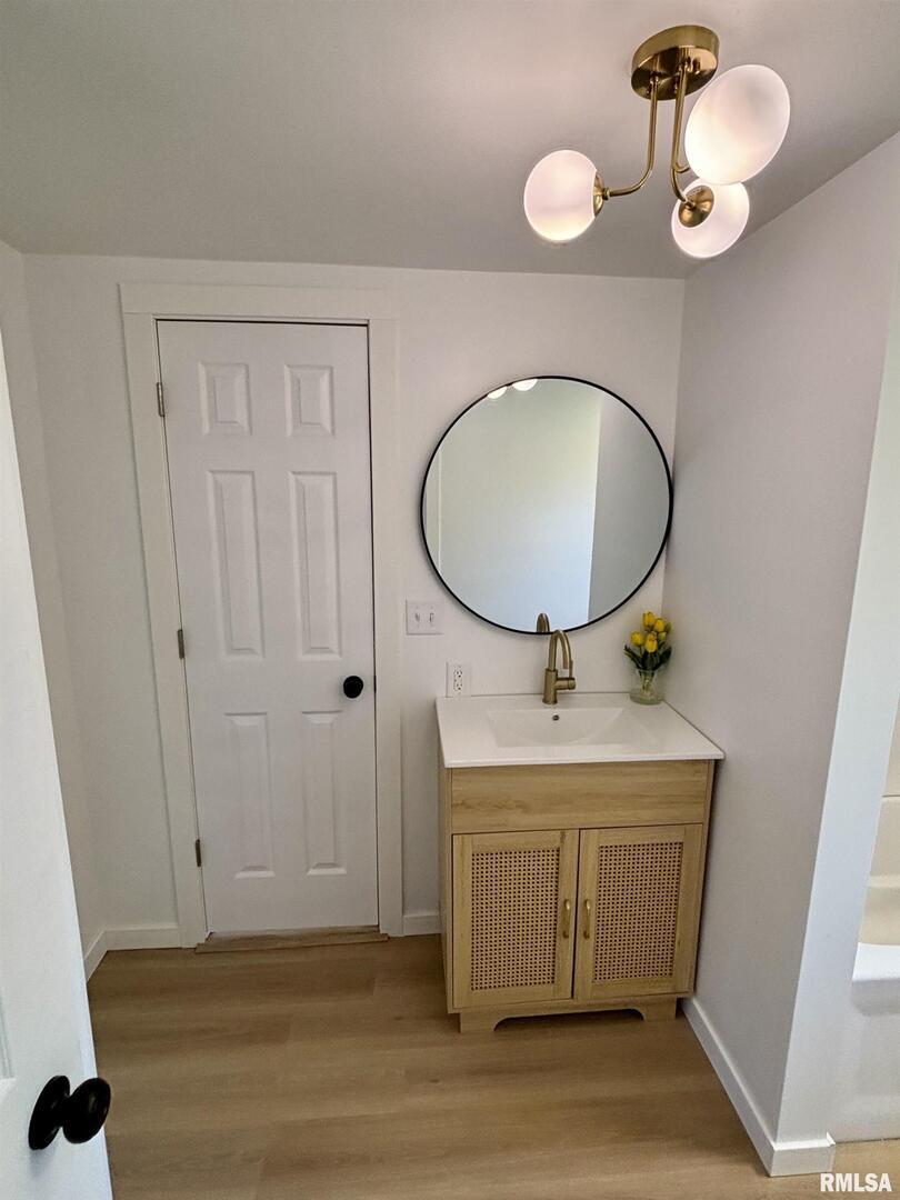 527 South Rotan Street Salem, IL 62881 - Photo 12 of 17 a bathroom with a sink mirror and vanity
