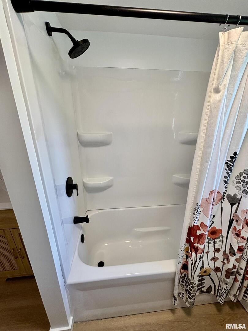 527 South Rotan Street Salem, IL 62881 - Photo 14 of 17 a bathroom with a bathtub and a shower