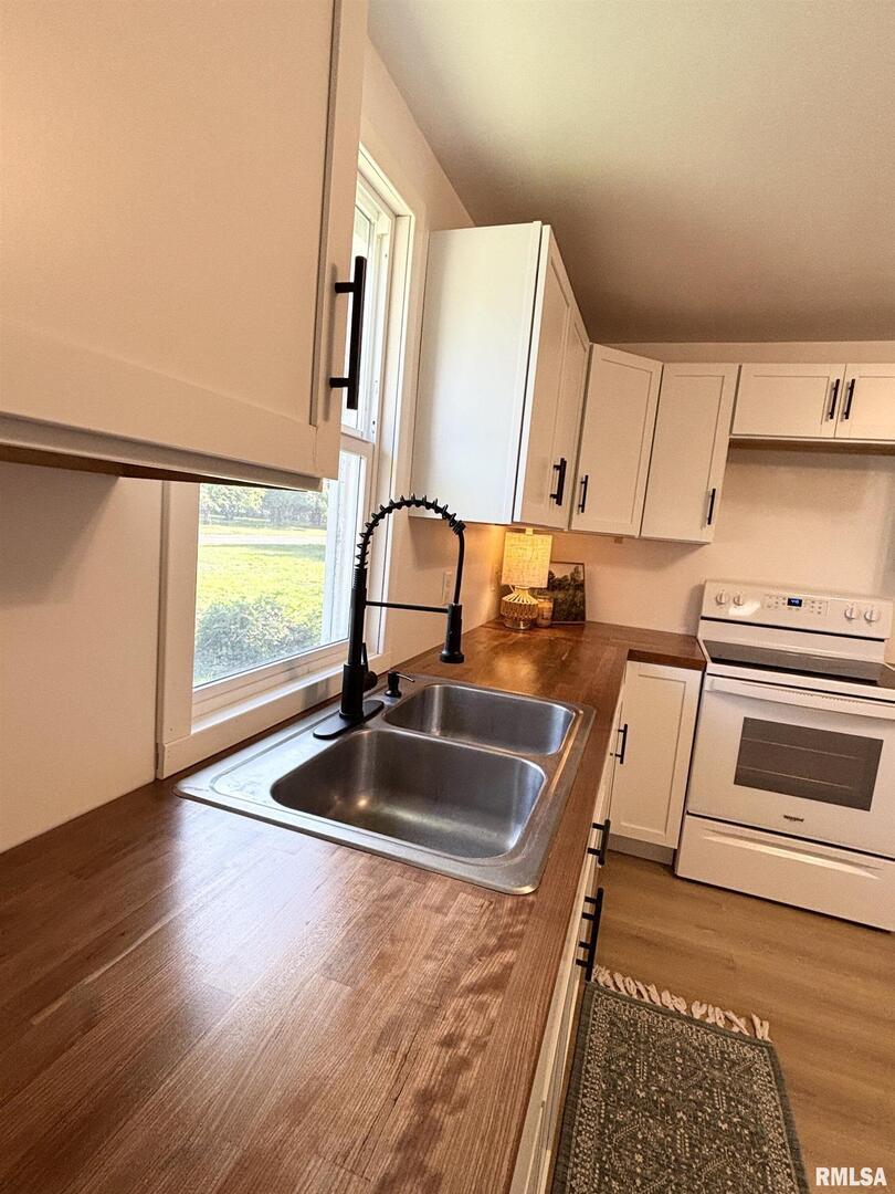 527 South Rotan Street Salem, IL 62881 - Photo 10 of 17 a kitchen with a sink and a stove top oven