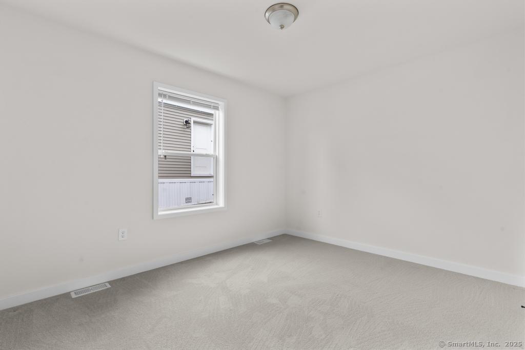 55 Sugar Street, Unit 2 Newtown, CT 06470 - Photo 14 of 19 an empty room with a window