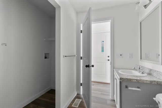 a bathroom with a granite countertop sink