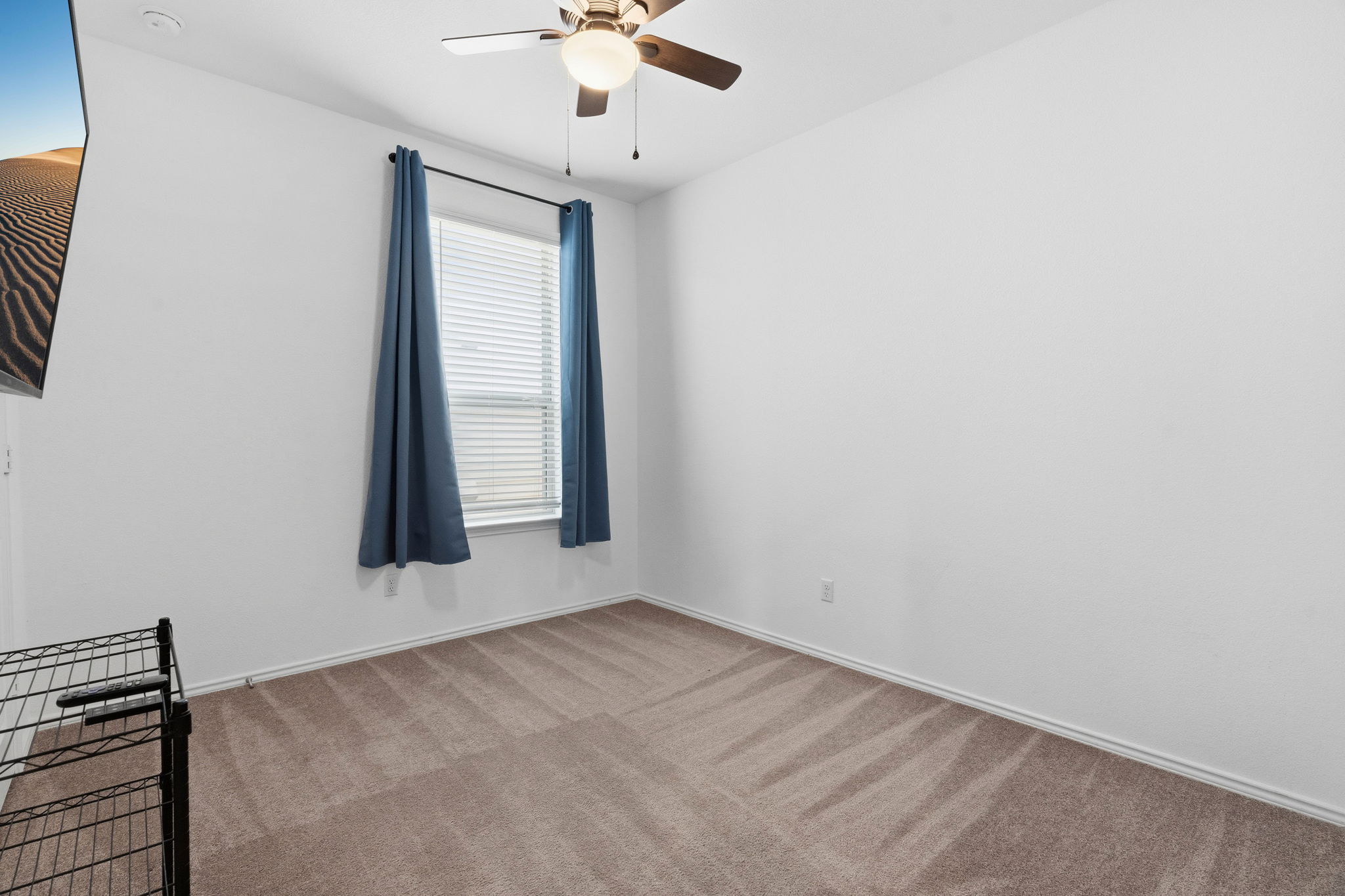 1600 Hope Rnch Road Leander, TX 78641 - Photo 19 of 23 an empty room with a chandelier fan and windows