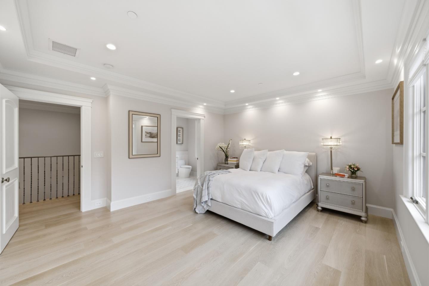 830 Bromfield Road San Mateo, CA 94402 - Photo 50 of 93 a spacious bedroom with a bed and a table