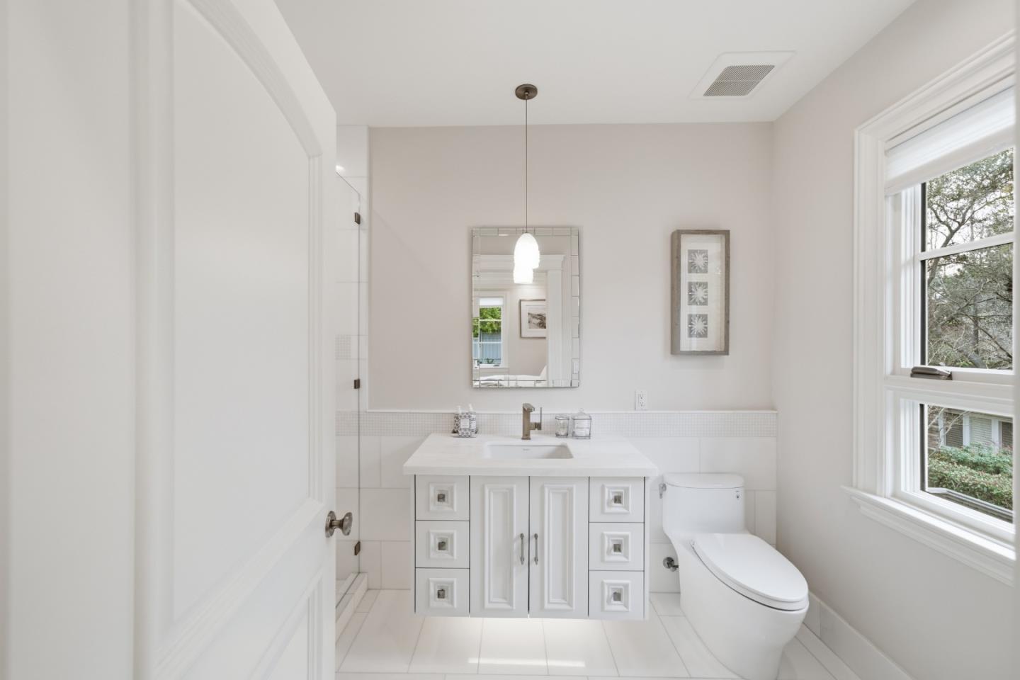 830 Bromfield Road San Mateo, CA 94402 - Photo 52 of 93 a bathroom with a toilet sink and mirror