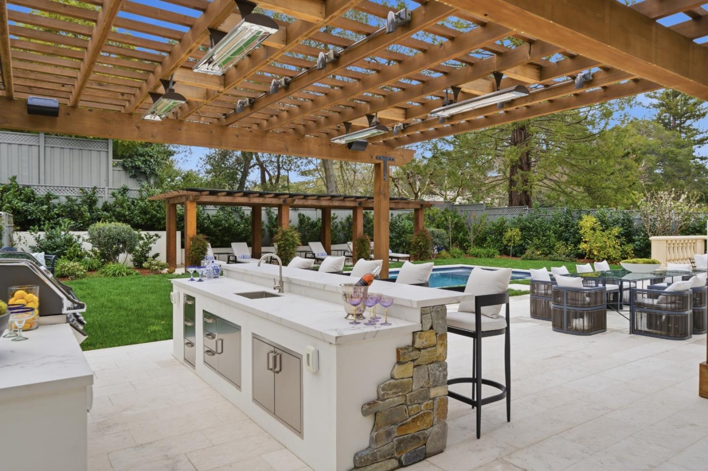 830 Bromfield Road San Mateo, CA 94402 - Photo 70 of 93 a view of a patio with table and chairs potted plants with wooden fence