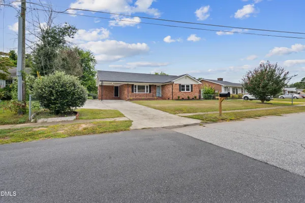 a view of an house with outdoor space and swimming pool