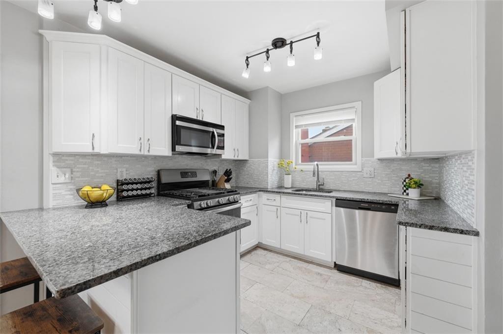 405 Shadyhill Road Pittsburgh, PA 15205 - Photo 15 of 34 a kitchen with sink stove top oven and microwave