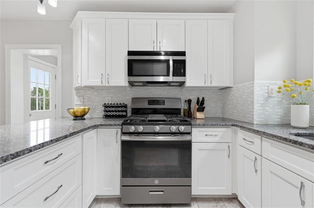 405 Shadyhill Road Pittsburgh, PA 15205 - Photo 16 of 34 a kitchen with stainless steel appliances granite countertop white cabinets and a stove