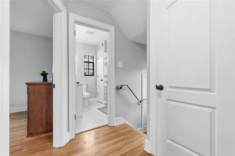a view of a bathroom from a hallway