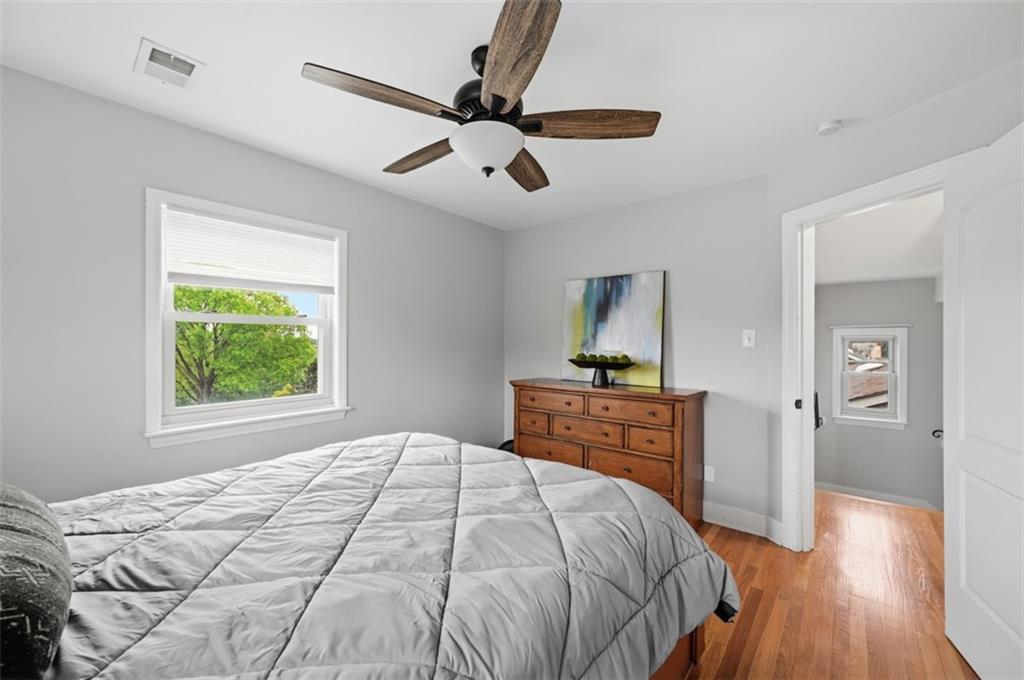 405 Shadyhill Road Pittsburgh, PA 15205 - Photo 22 of 34 a bedroom with a bed and wooden floor