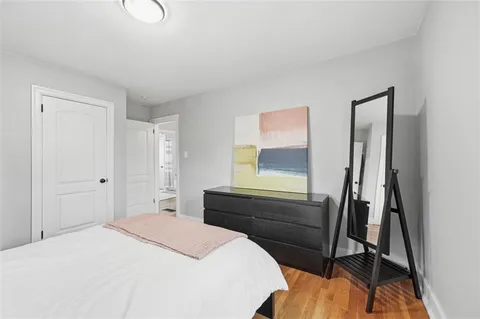 a bedroom with a bed and dresser