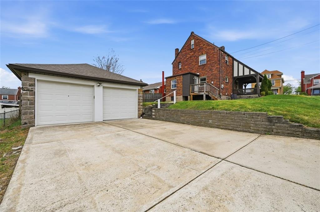 405 Shadyhill Road Pittsburgh, PA 15205 - Photo 30 of 34 a front view of a house with a yard and garage