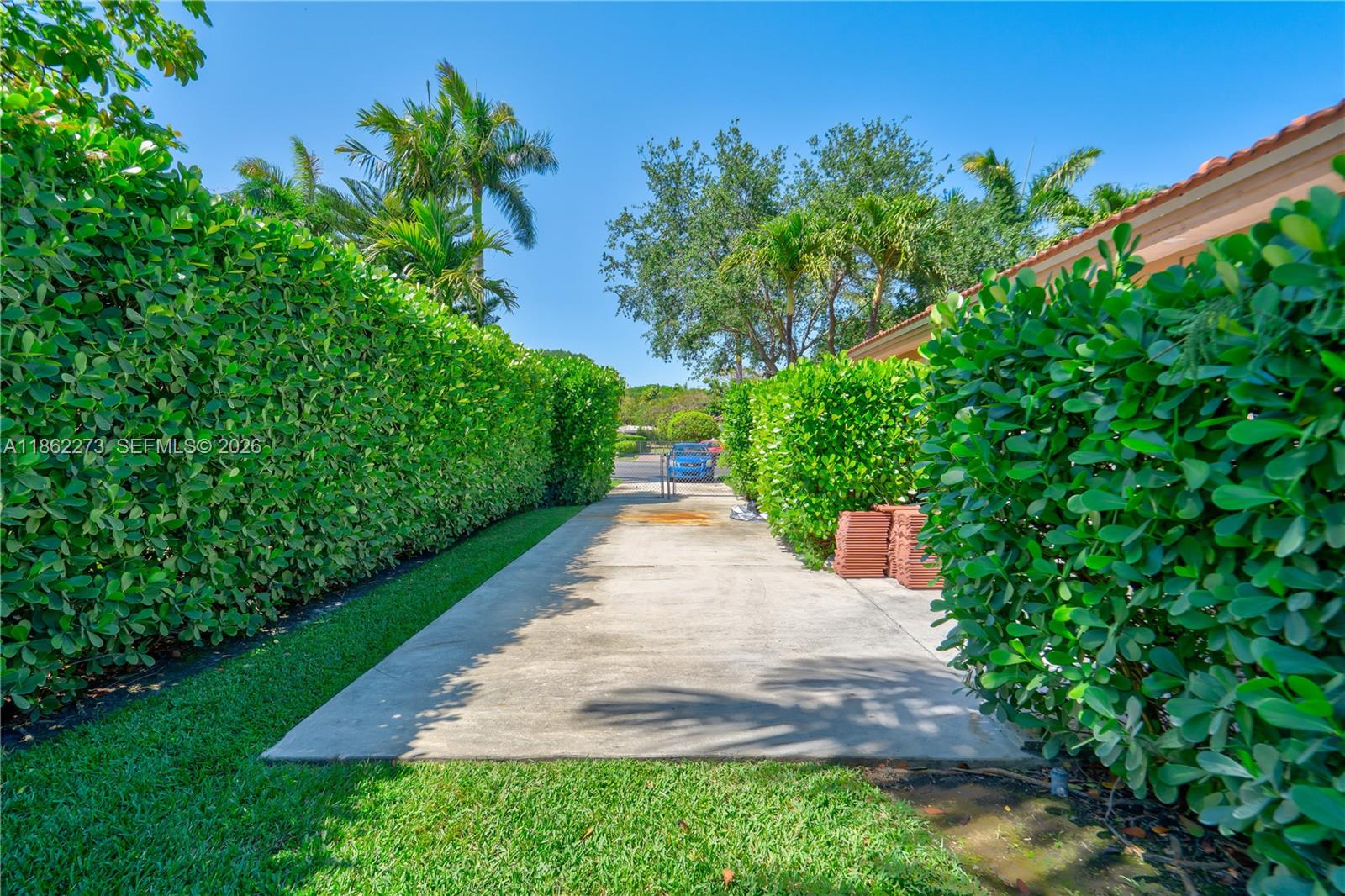 8366 Southwest 193rd Street Cutler Bay, FL 33157 - Photo 12 of 20 a view of a garden with pathway