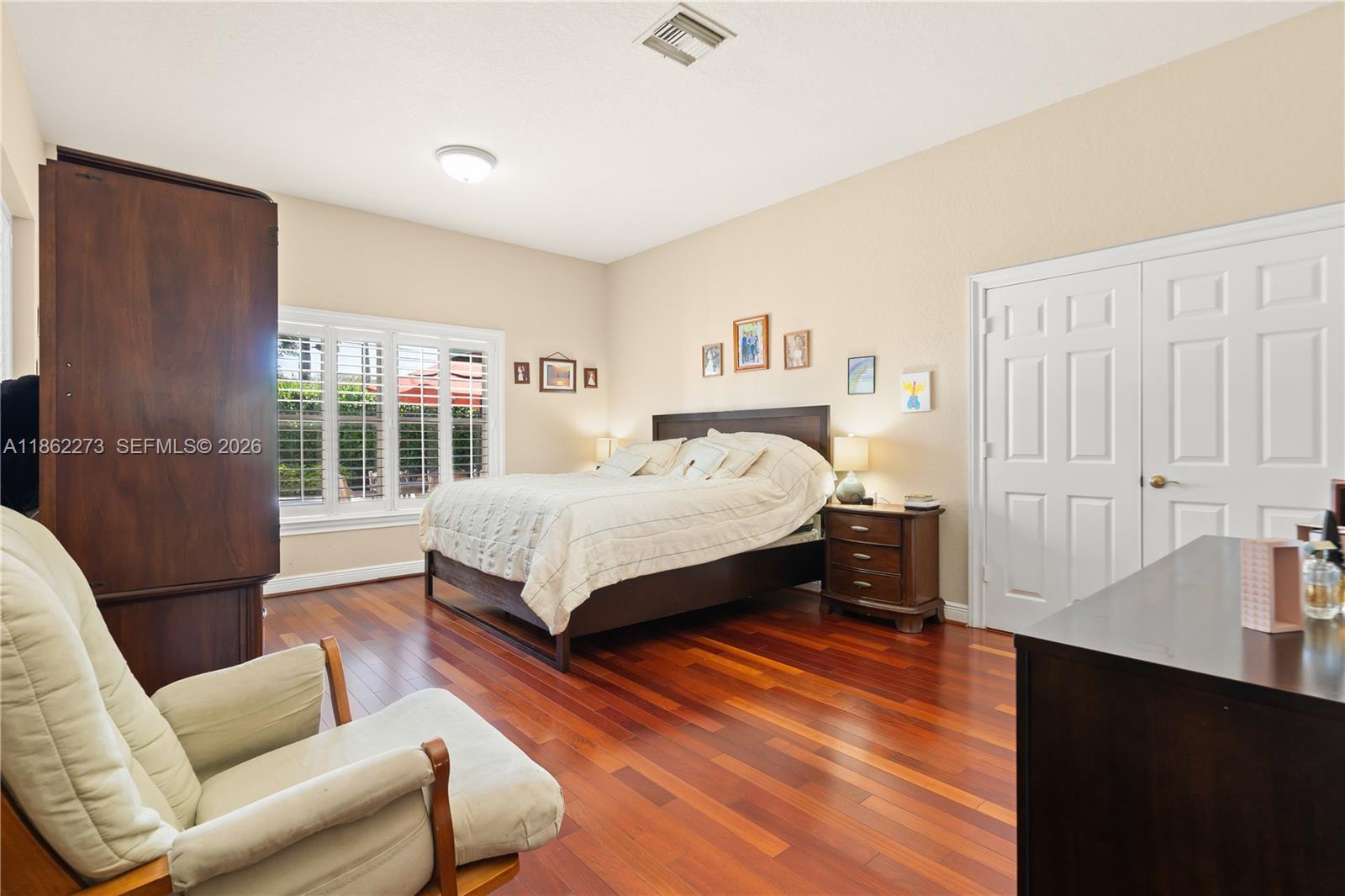 8366 Southwest 193rd Street Cutler Bay, FL 33157 - Photo 15 of 20 a bedroom with a bed couch and a window