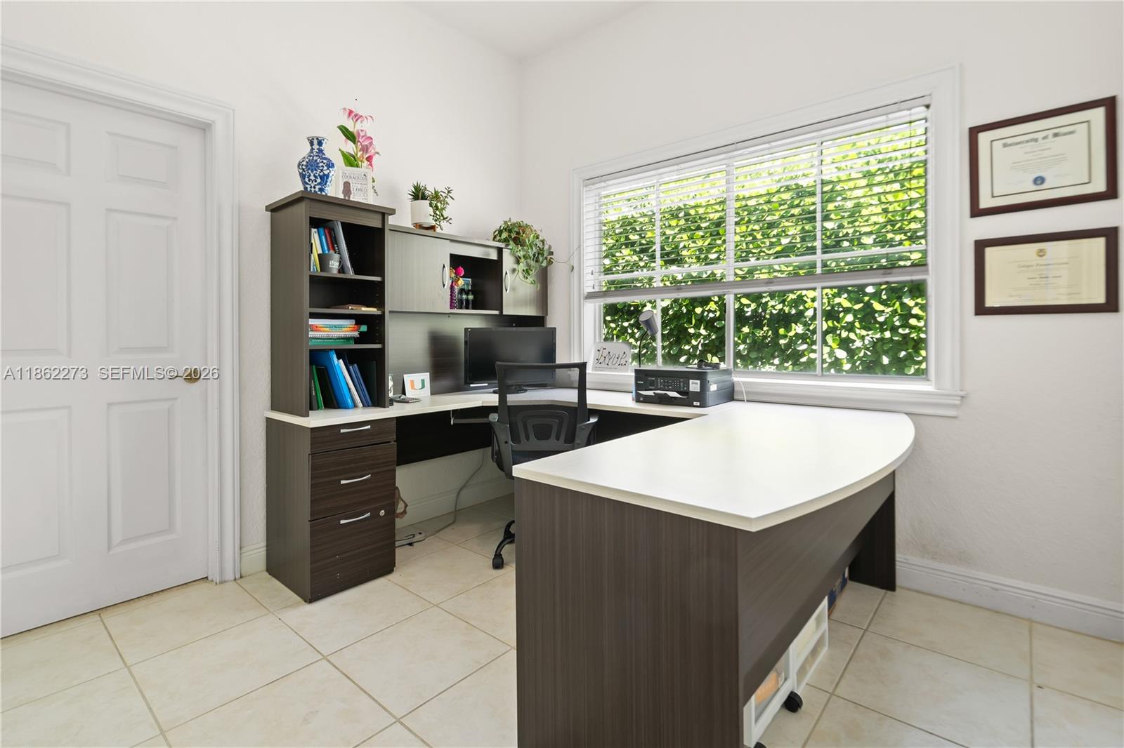 8366 Southwest 193rd Street Cutler Bay, FL 33157 - Photo 18 of 20 a kitchen with a cabinets and window