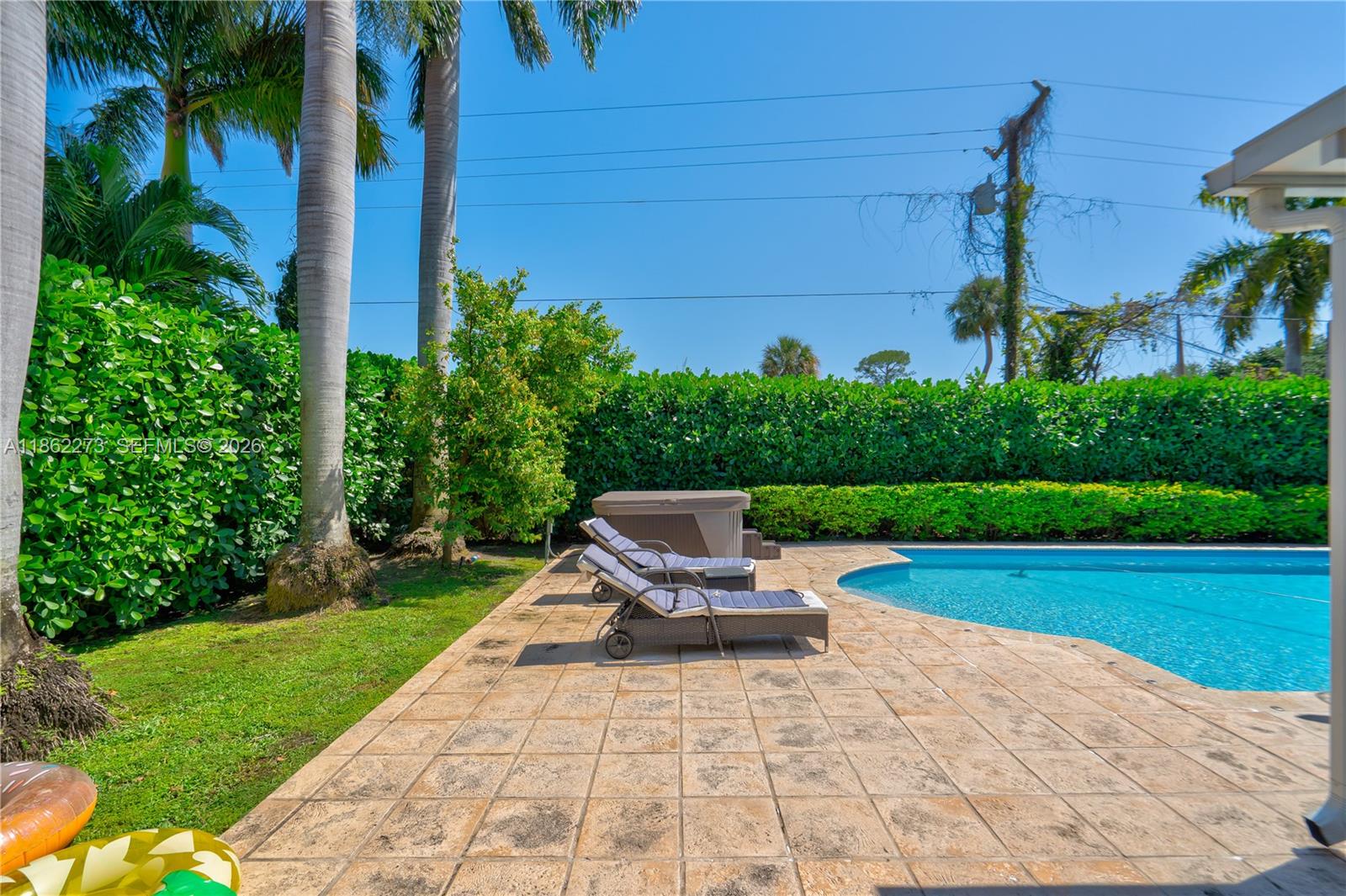 8366 Southwest 193rd Street Cutler Bay, FL 33157 - Photo 2 of 20 a view of a backyard with sitting area