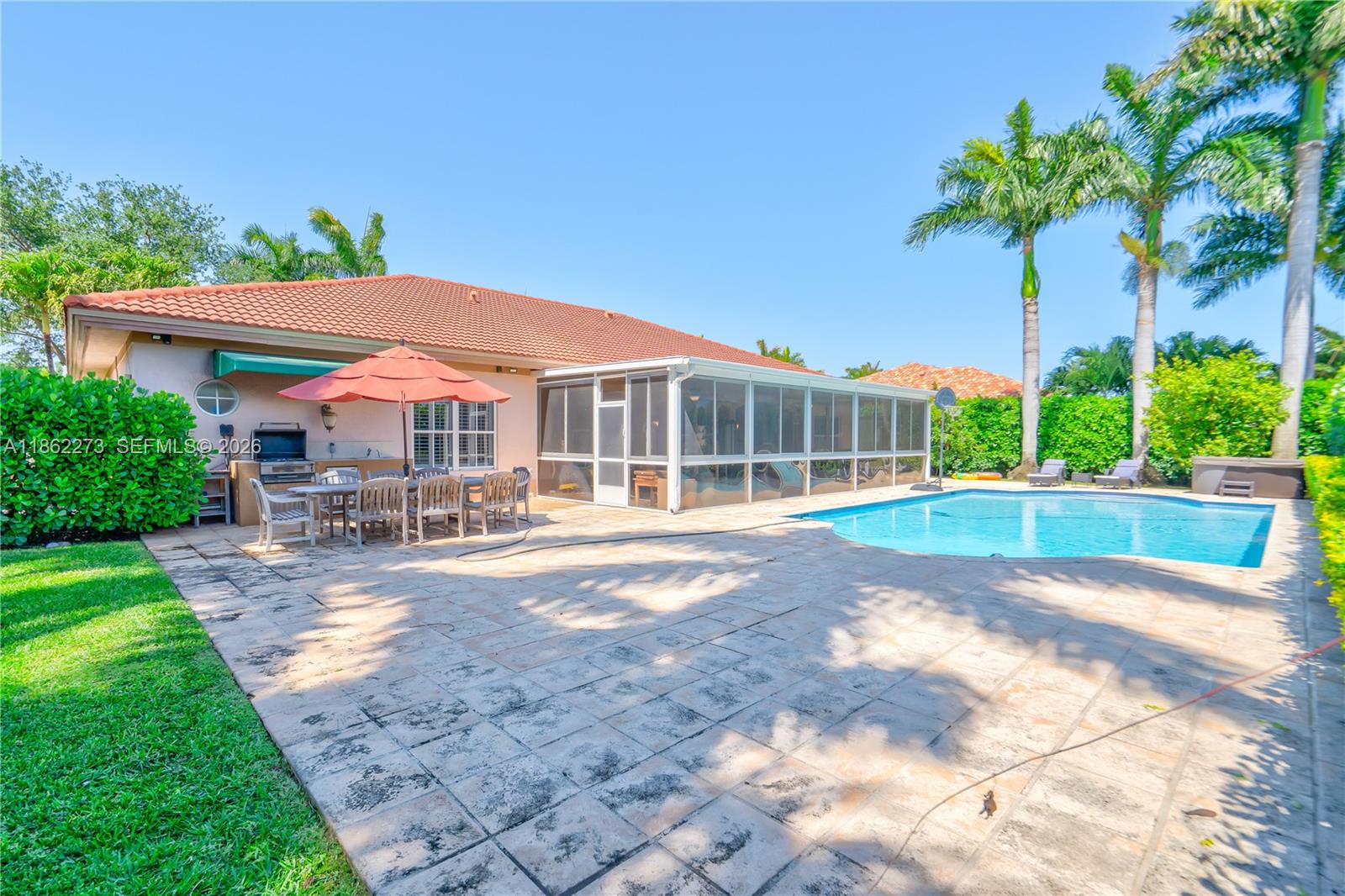 8366 Southwest 193rd Street Cutler Bay, FL 33157 - Photo 10 of 20 a view of a house with swimming pool and sitting area