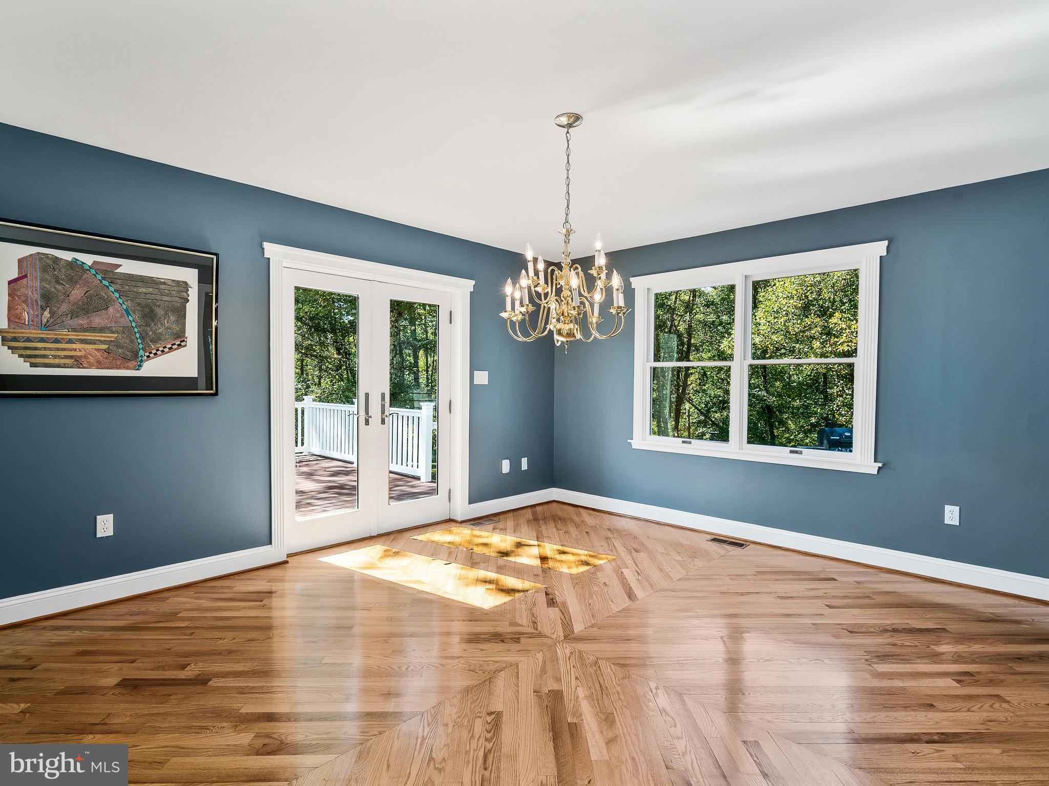 3444 Woodbine Road Woodbine, MD 21797 - Photo 13 of 78 a view of an empty room with window and chandelier