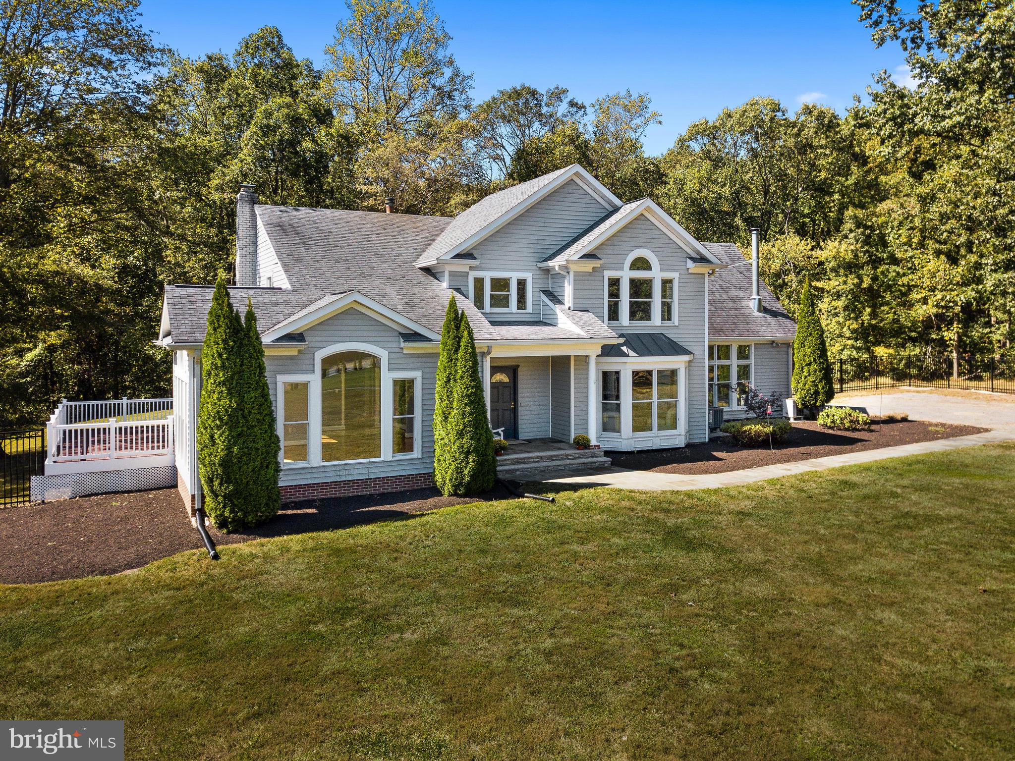 3444 Woodbine Road Woodbine, MD 21797 - Photo 27 of 78 a front view of a house with a yard