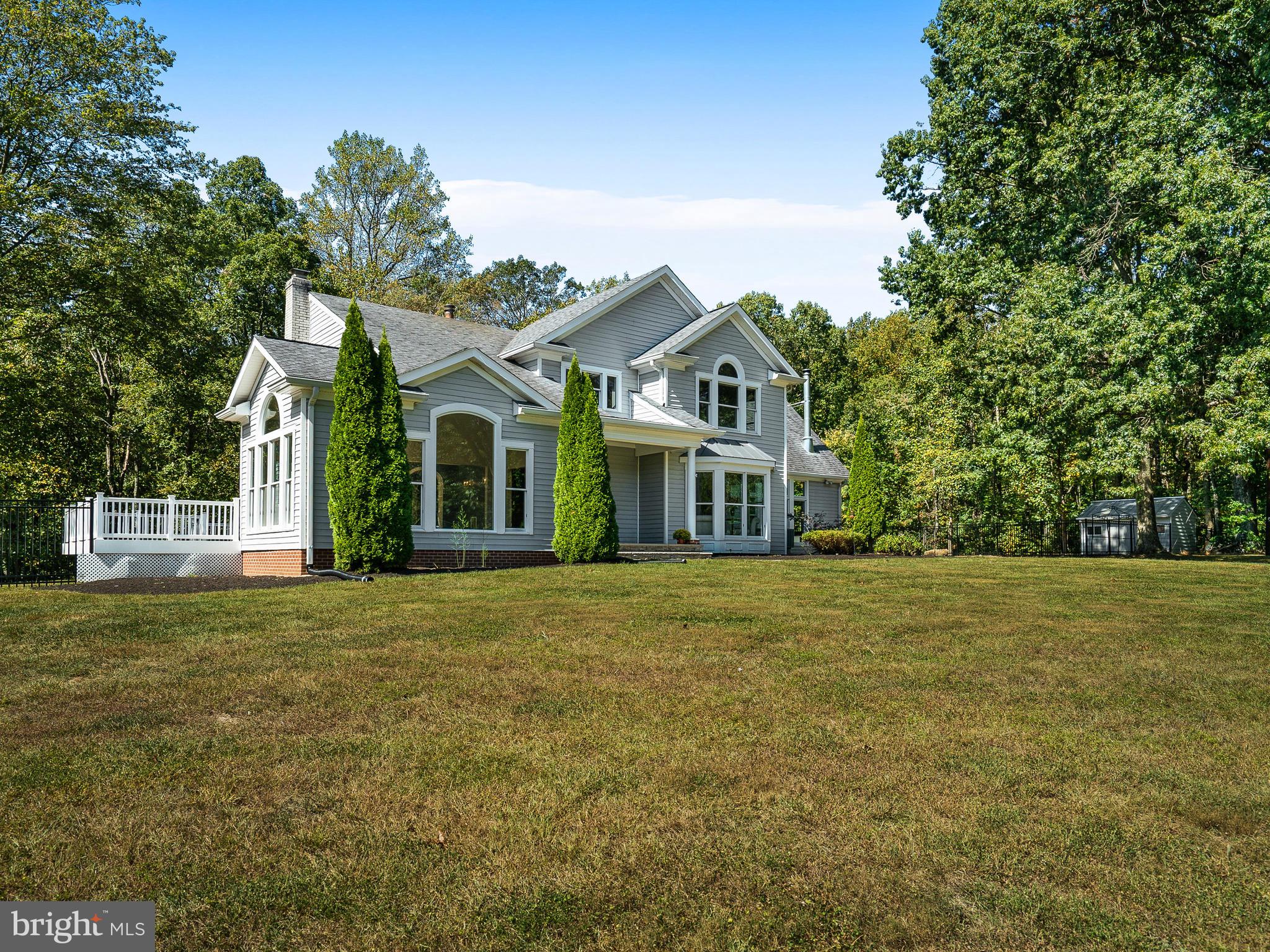 3444 Woodbine Road Woodbine, MD 21797 - Photo 34 of 78 a front view of a house with a garden
