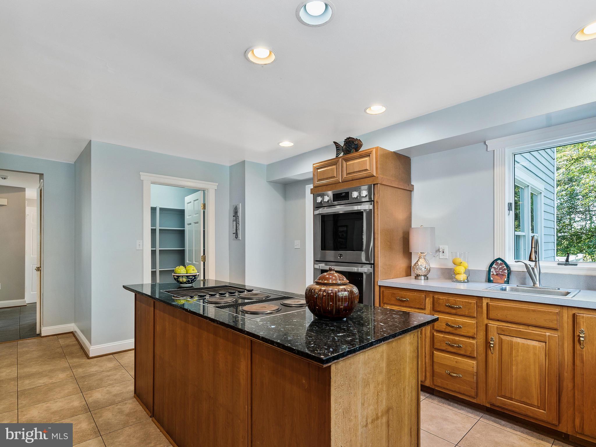 3444 Woodbine Road Woodbine, MD 21797 - Photo 41 of 78 a kitchen with granite countertop a sink and cabinets