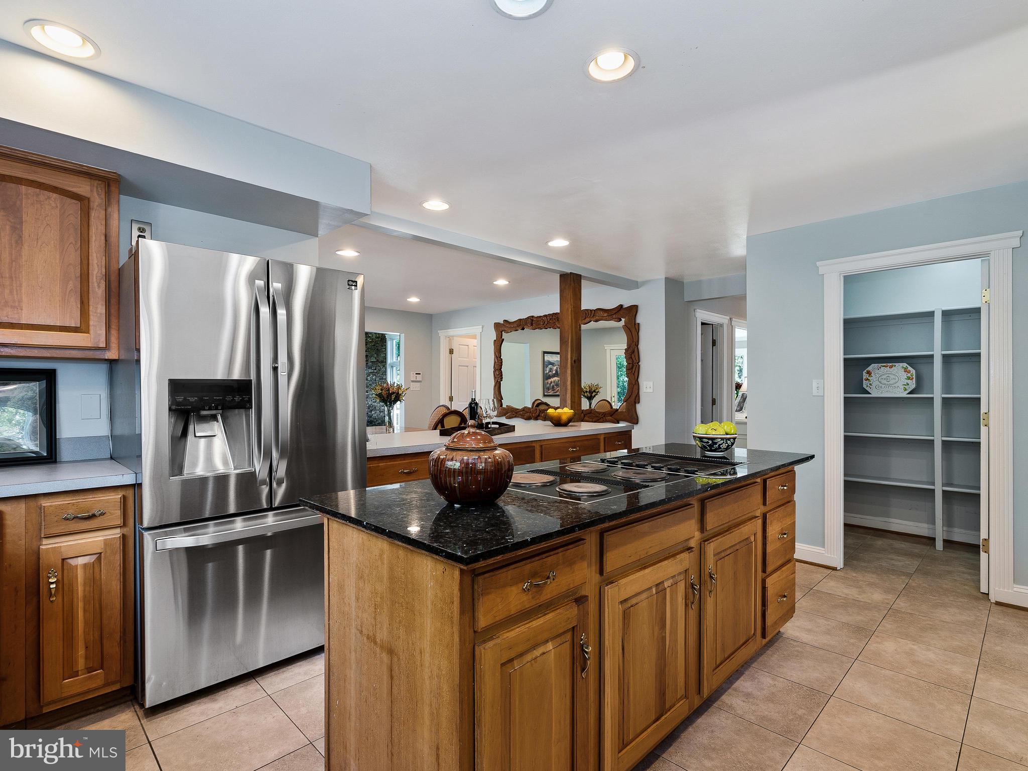 3444 Woodbine Road Woodbine, MD 21797 - Photo 42 of 78 a kitchen with stainless steel appliances granite countertop a sink and cabinets