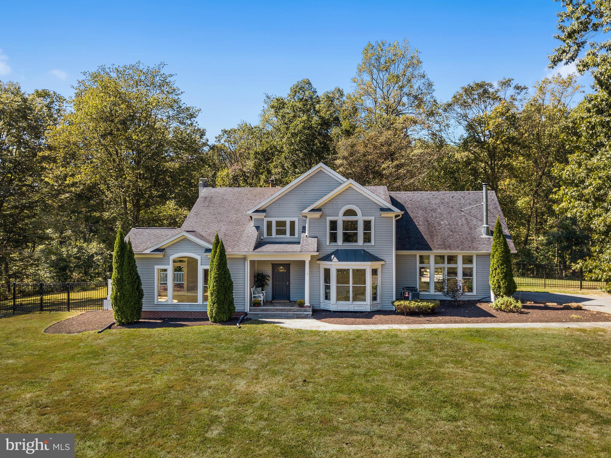3444 Woodbine Road Woodbine, MD 21797 - Photo 52 of 78 a front view of a house with a garden