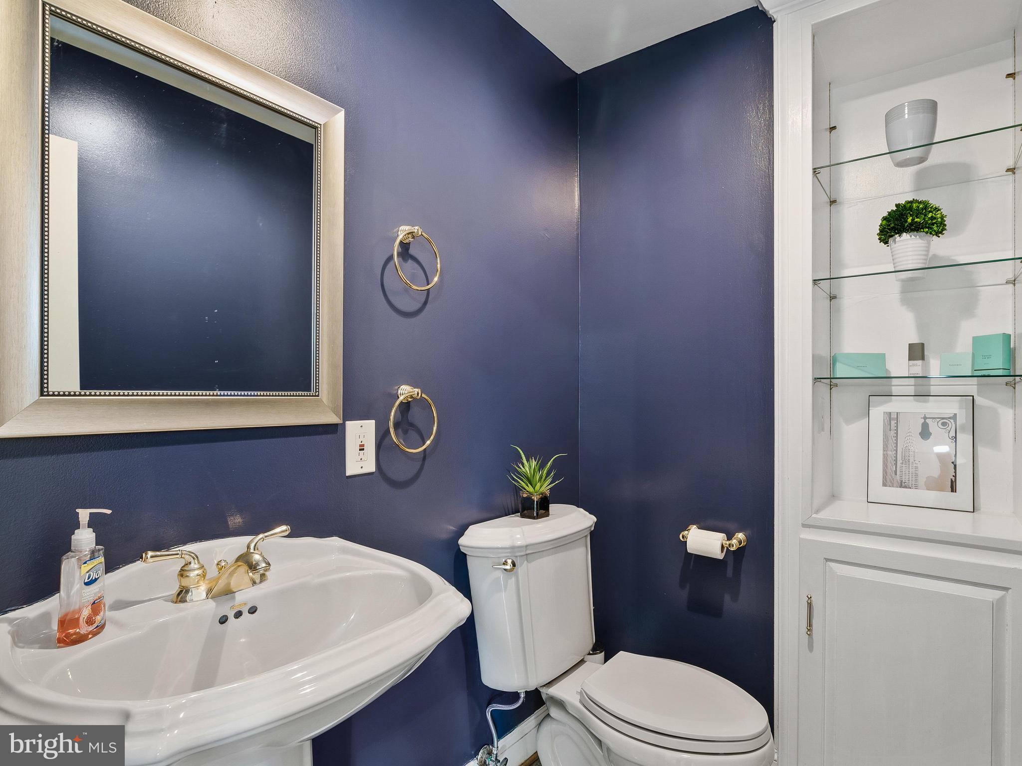 3444 Woodbine Road Woodbine, MD 21797 - Photo 53 of 78 a bathroom with a sink a toilet and mirror