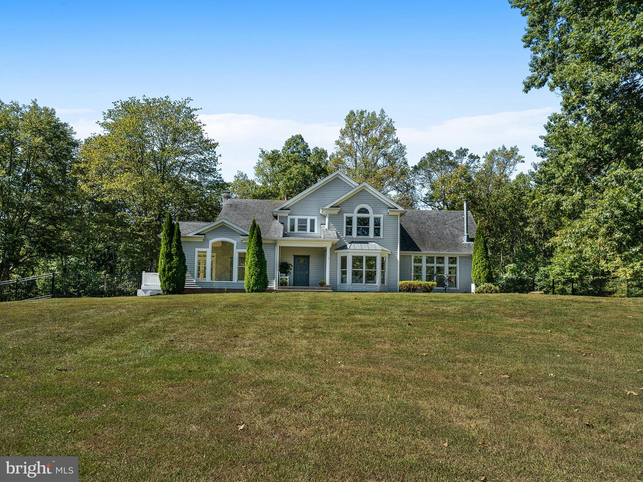 3444 Woodbine Road Woodbine, MD 21797 - Photo 57 of 78 a front view of a house with a garden