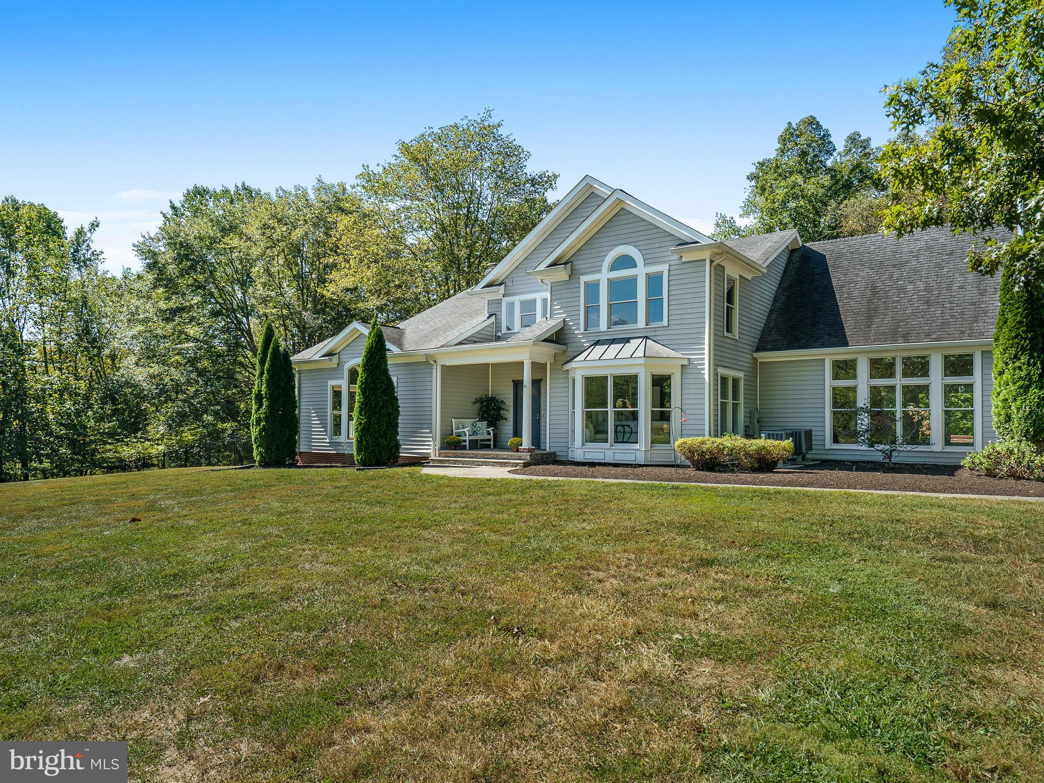 3444 Woodbine Road Woodbine, MD 21797 - Photo 58 of 78 a front view of a house with a garden