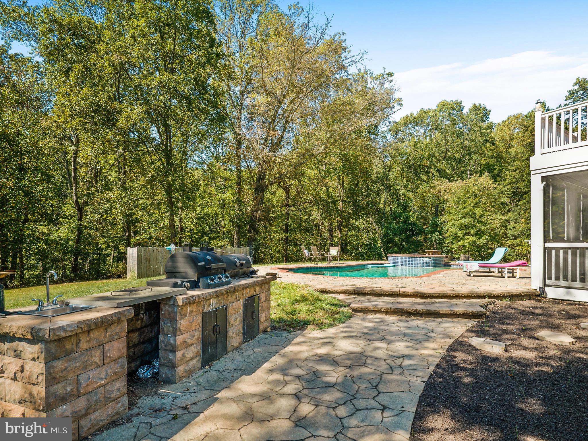 3444 Woodbine Road Woodbine, MD 21797 - Photo 59 of 78 a view of a swimming pool with a patio