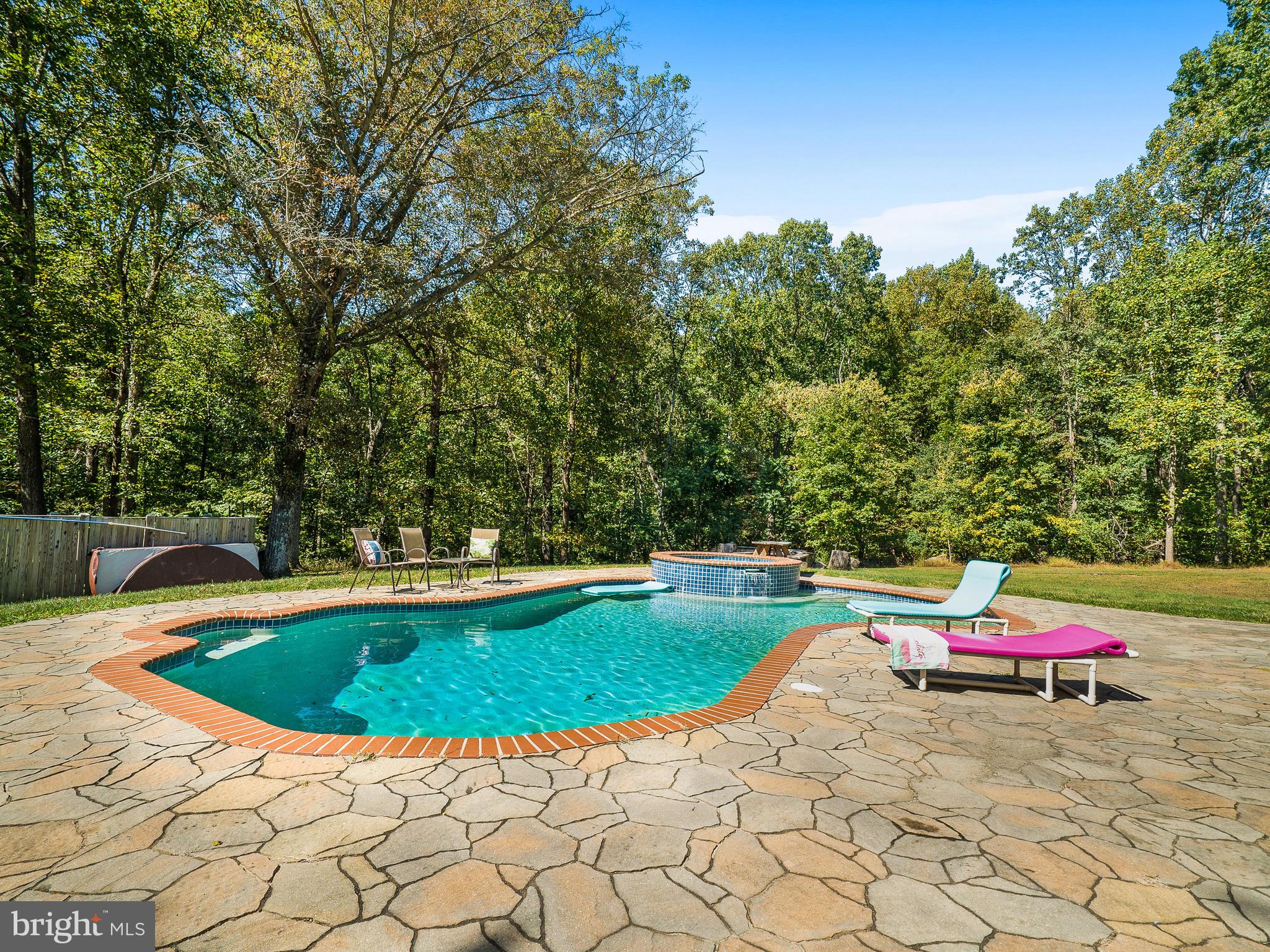 3444 Woodbine Road Woodbine, MD 21797 - Photo 60 of 78 a view of a swimming pool with a yard