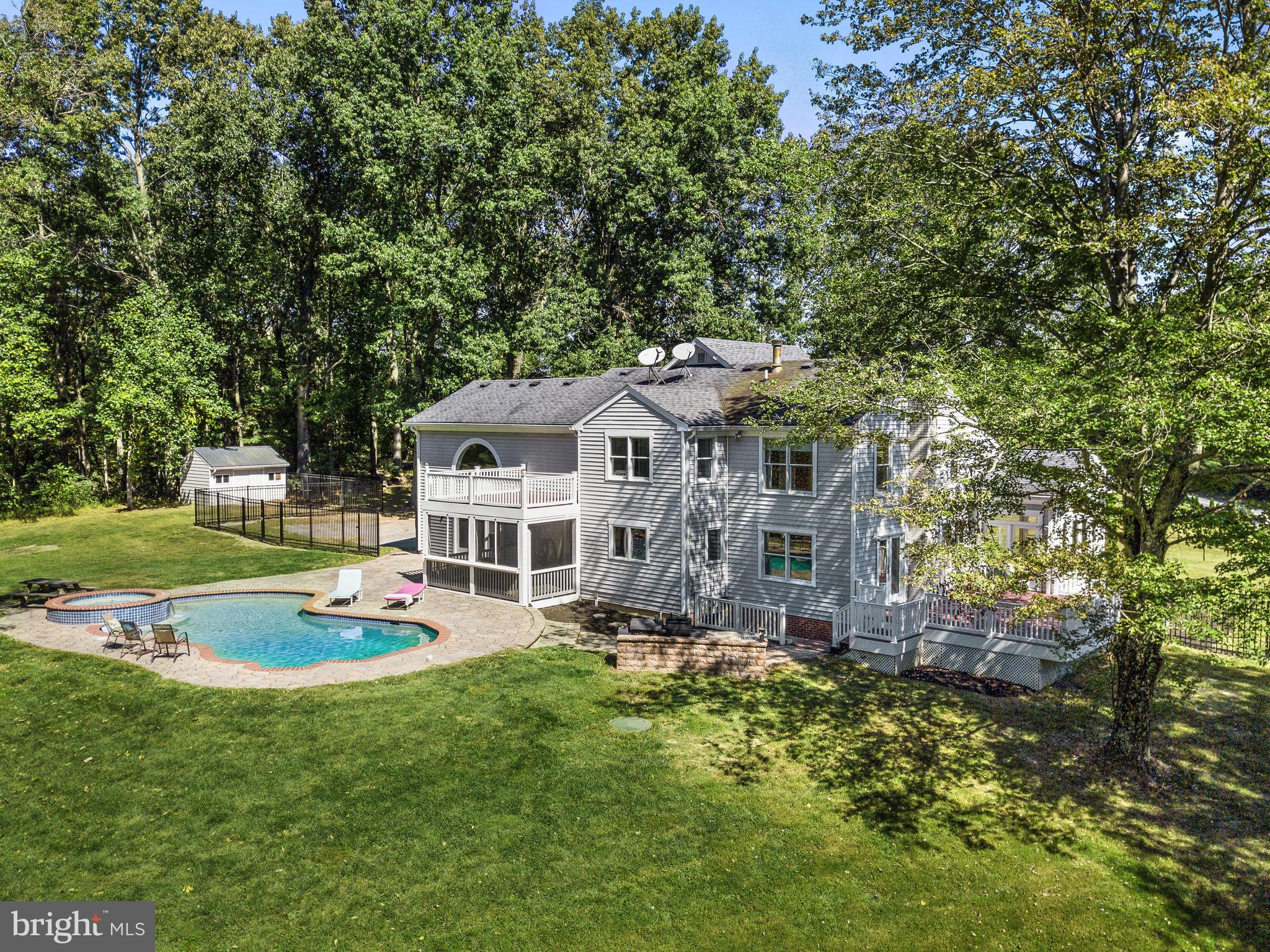 3444 Woodbine Road Woodbine, MD 21797 - Photo 63 of 78 a front view of a house with a garden and trees