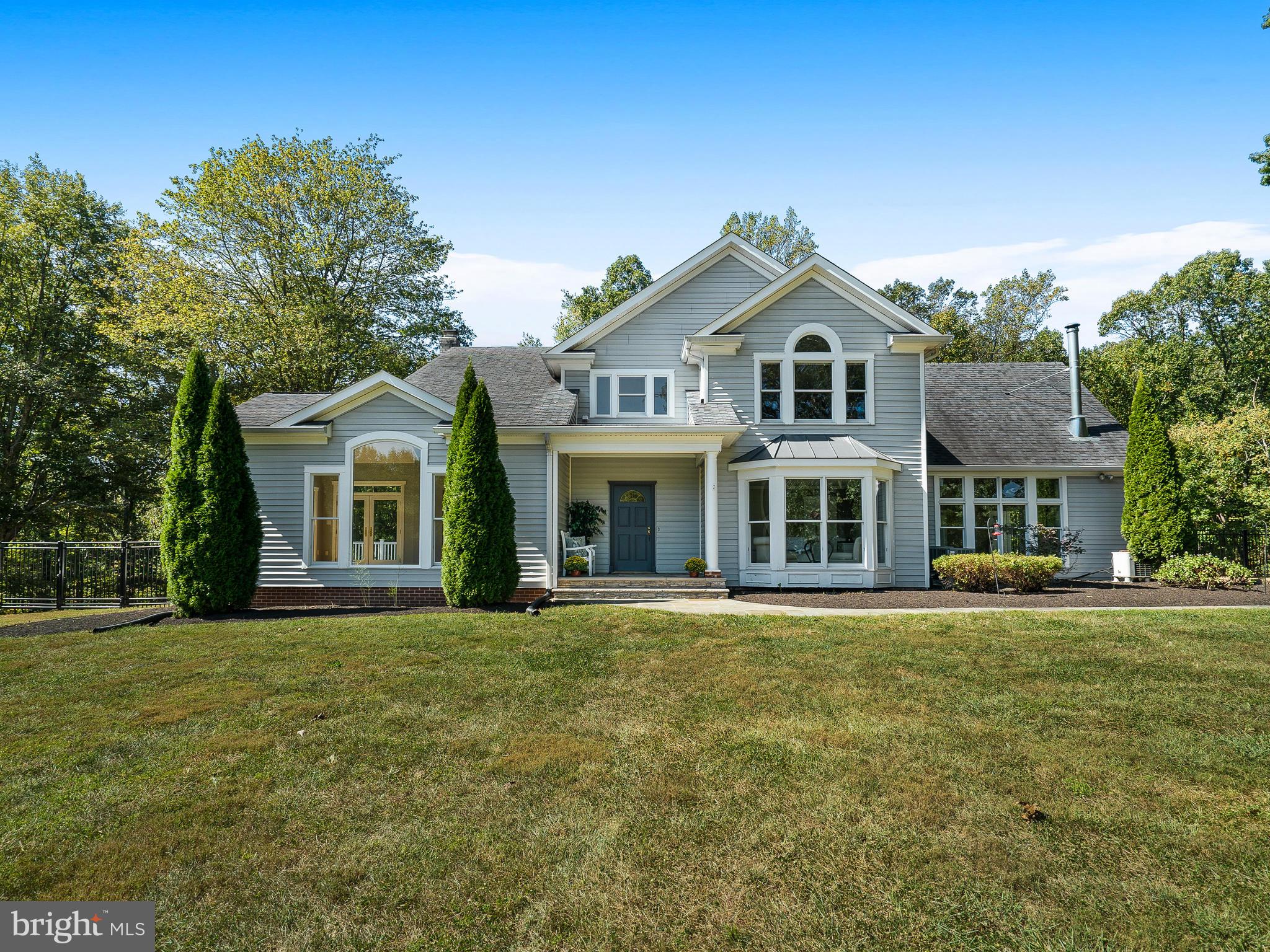 3444 Woodbine Road Woodbine, MD 21797 - Photo 66 of 78 a front view of a house with a garden