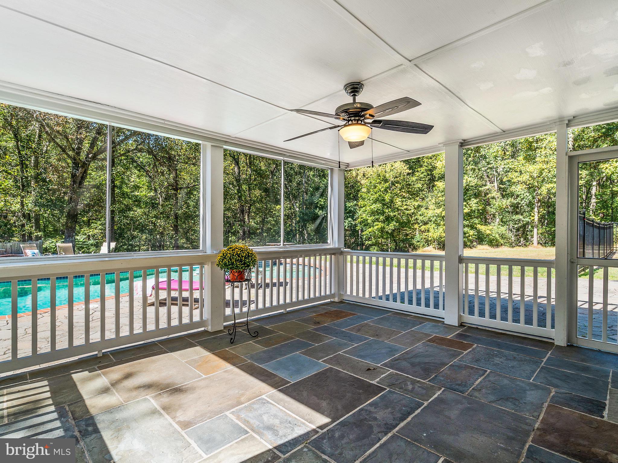 3444 Woodbine Road Woodbine, MD 21797 - Photo 10 of 78 a view of a porch with wooden floor and furniture