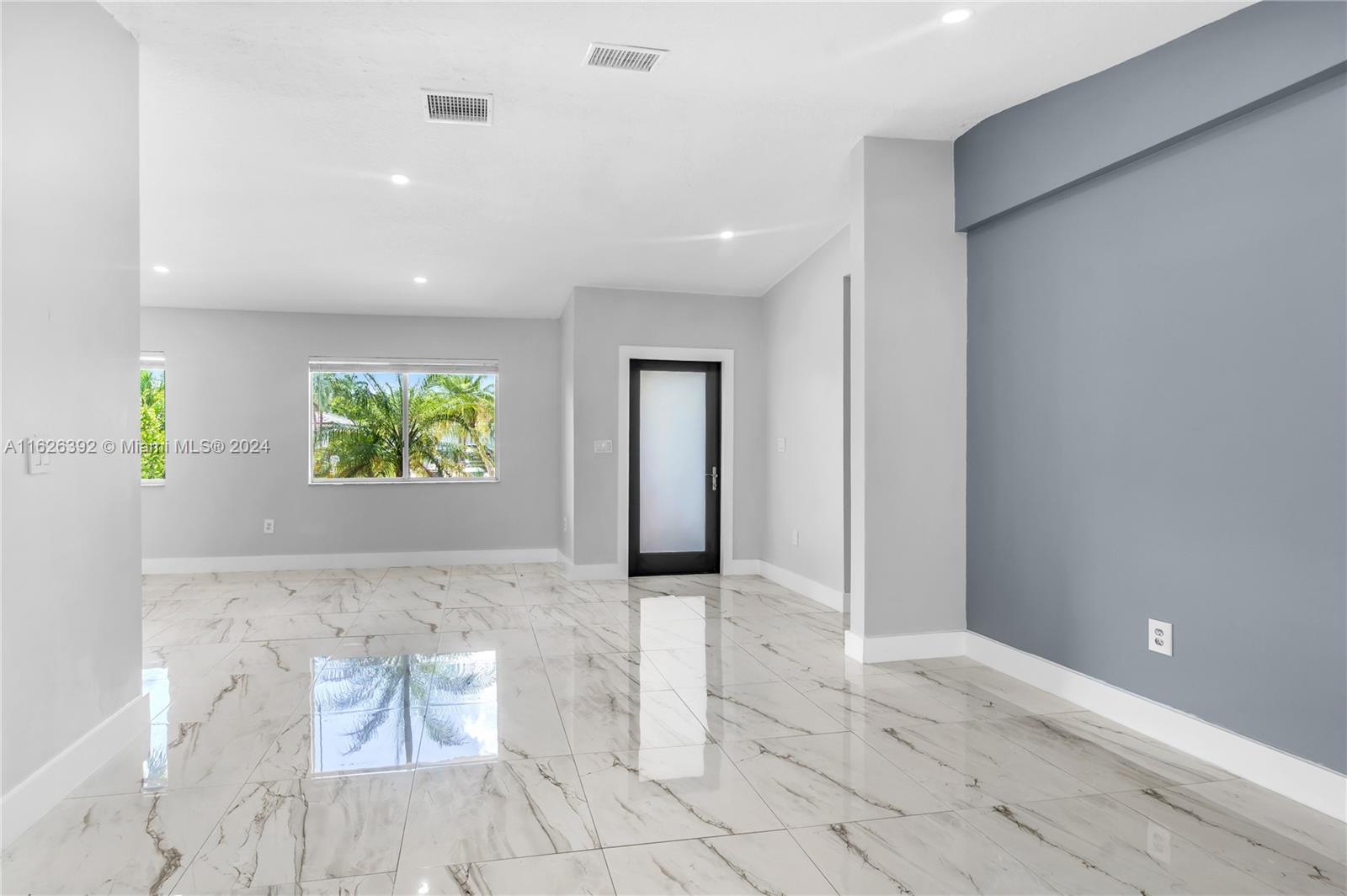 Goulds Miami, FL 33170 - Photo 11 of 36 wooden floor in an empty room and a window
