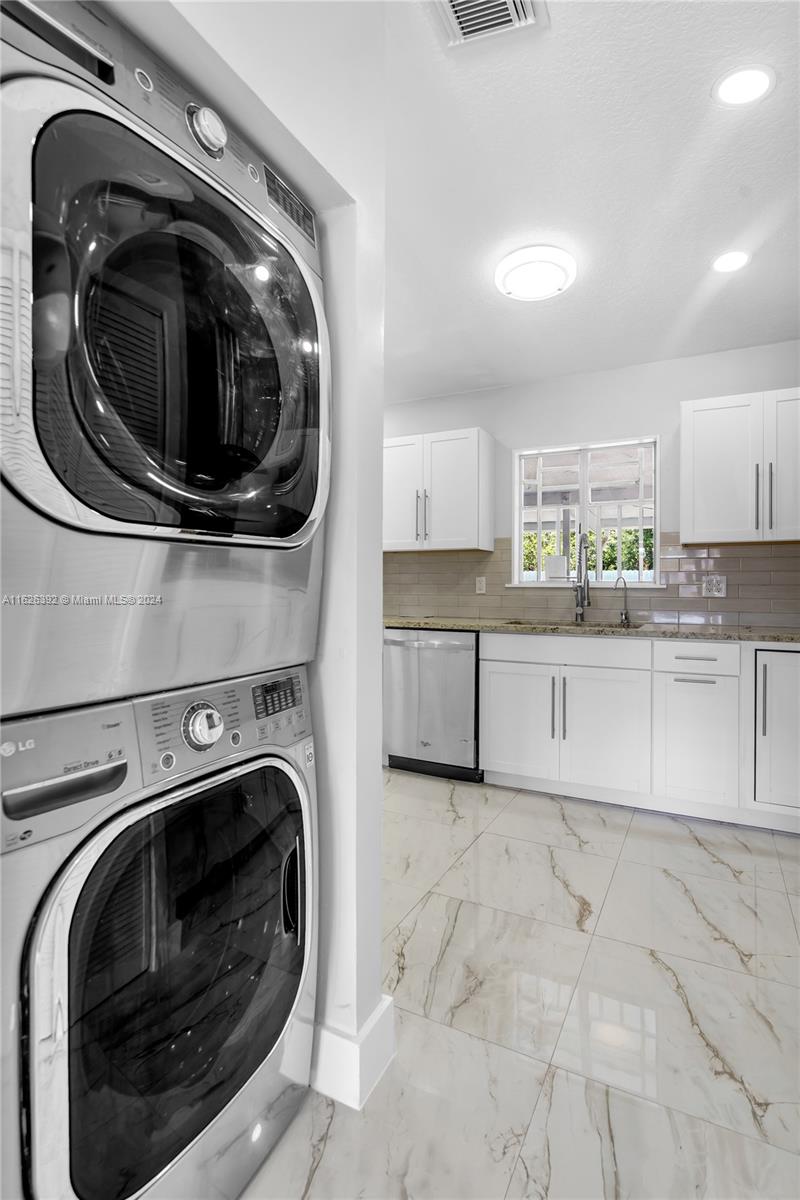Goulds Miami, FL 33170 - Photo 14 of 36 a utility room with sink dryer and washer
