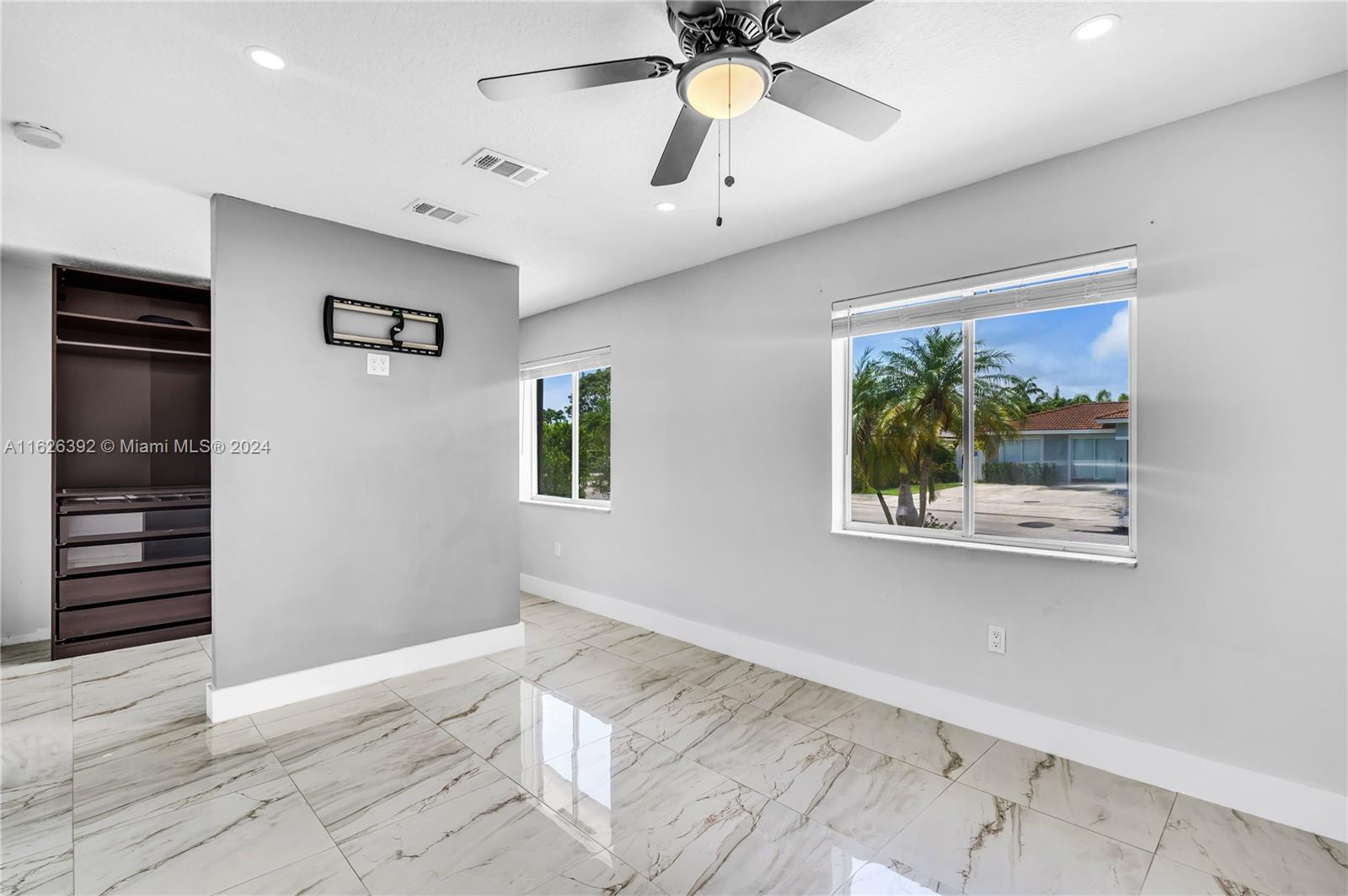 Goulds Miami, FL 33170 - Photo 21 of 36 a view of a hallway with a window and wooden floor