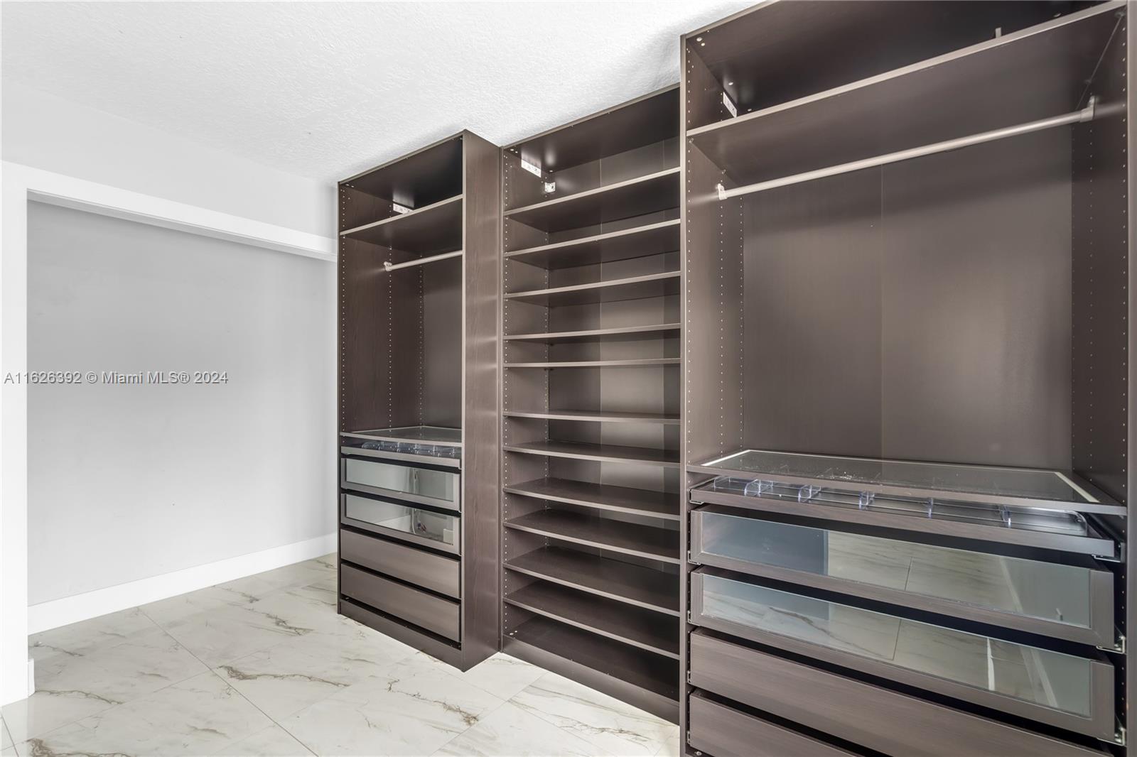 Goulds Miami, FL 33170 - Photo 23 of 36 a view of walk in closet with empty racks
