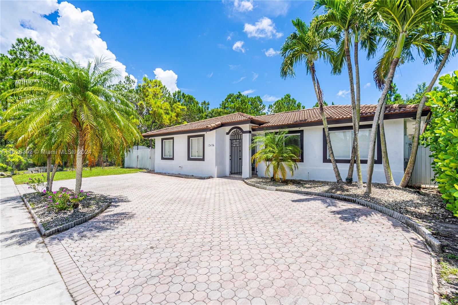 Goulds Miami, FL 33170 - Photo 3 of 36 a front view of a house with a garden