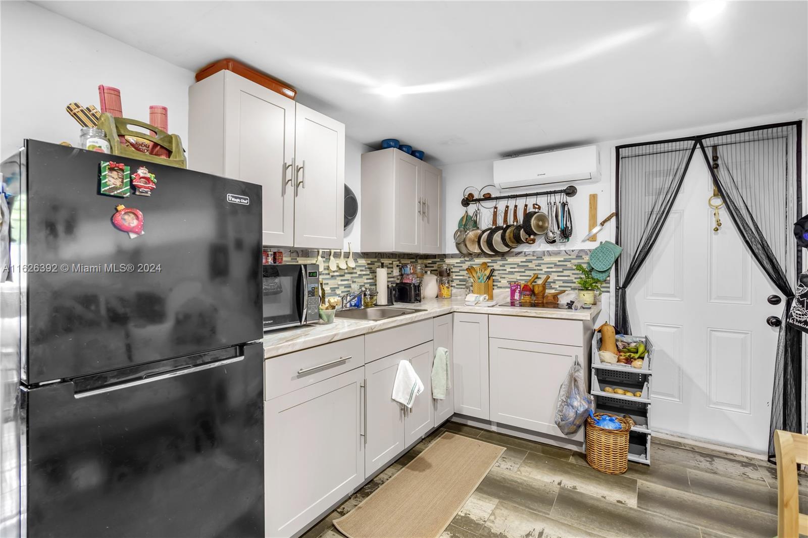 Goulds Miami, FL 33170 - Photo 33 of 36 a kitchen with granite countertop a refrigerator and a stove top oven