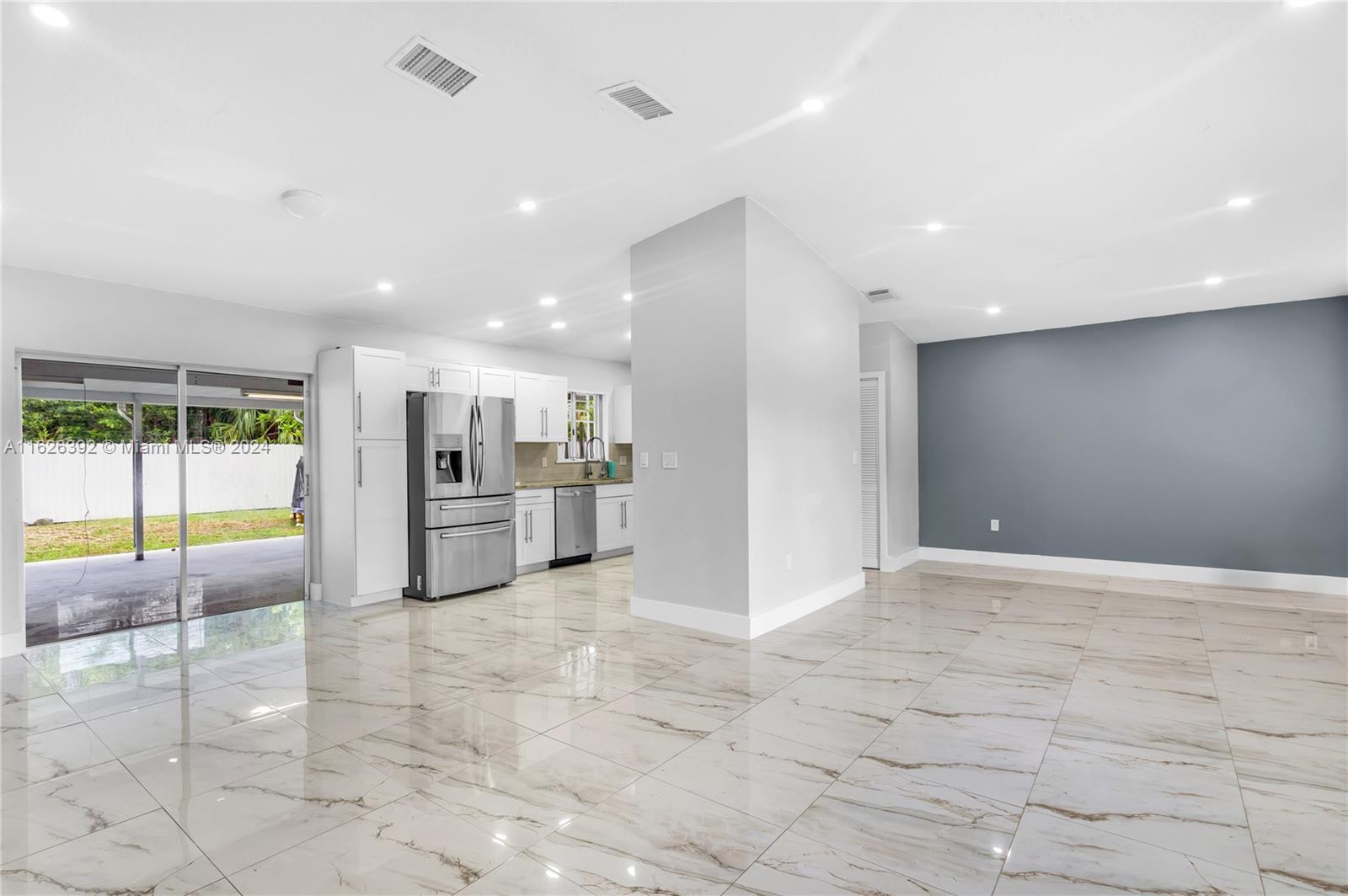 Goulds Miami, FL 33170 - Photo 8 of 36 a view of an empty room with kitchen and living room