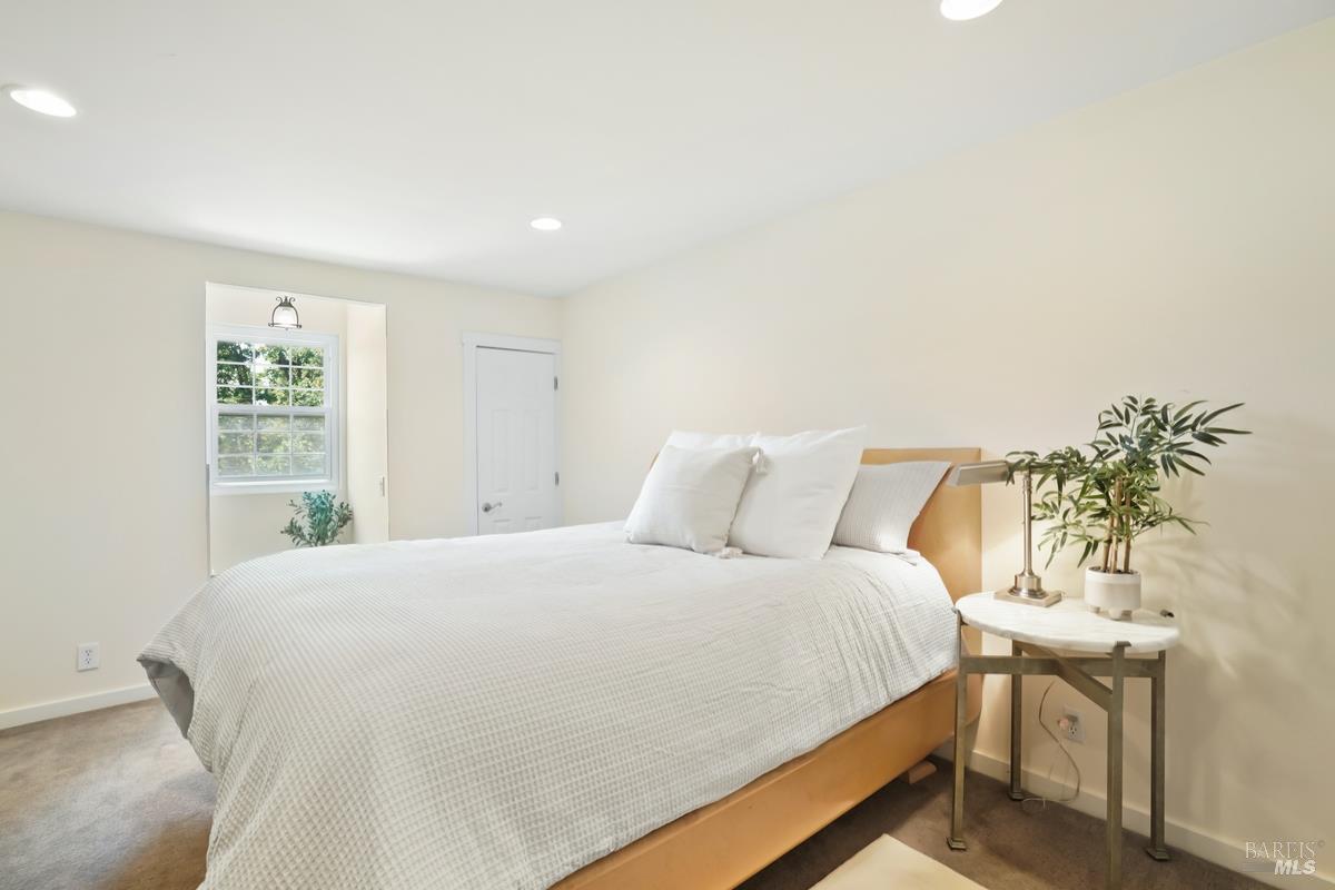 1846 Indian Valley Road, Unit A Novato, CA 94947 - Photo 35 of 45 a bedroom with a bed and a potted plant