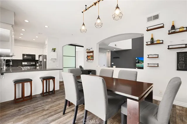 a view of kitchen with cabinets and wooden floor